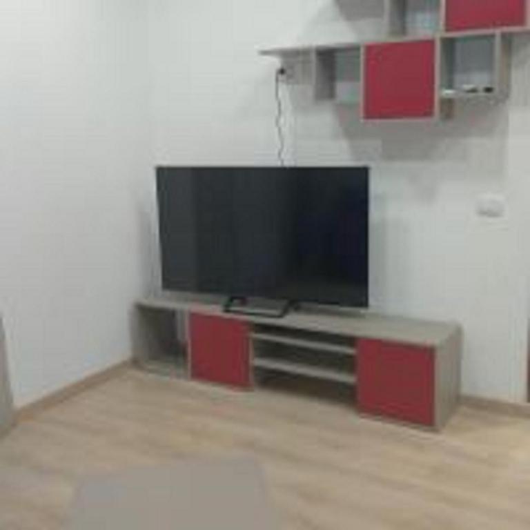 A television and/or entertainment centre at Renovated Loft with Vesuvio view terrace