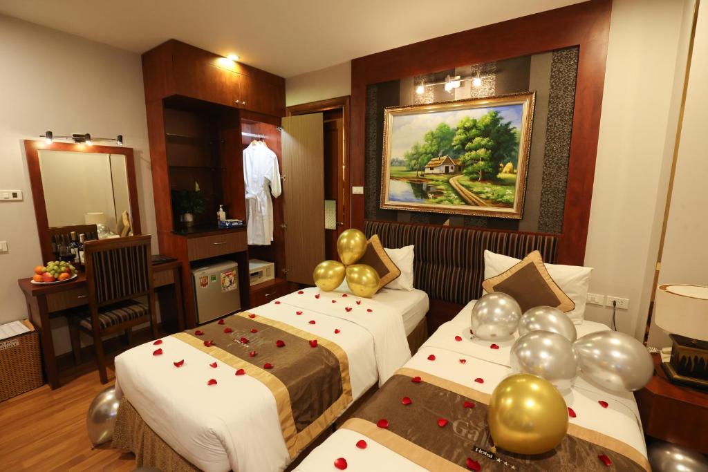 Postel nebo postele na pokoji v ubytování Gallant Hotel