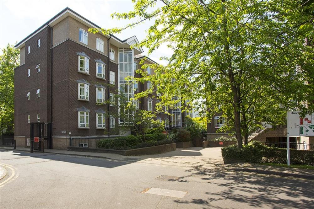 a large brick building with a tree in front of it at Ifor Evans Hall, Camden in London