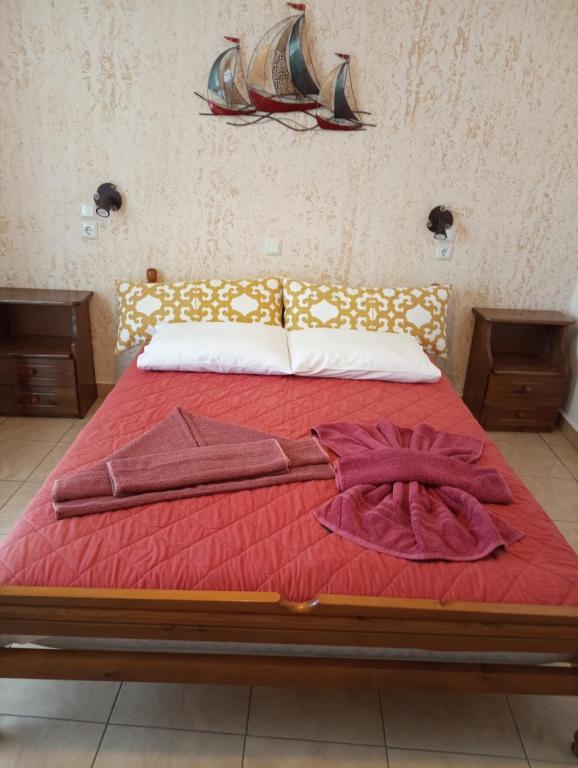 A bed or beds in a room at Nektaria on the Beach