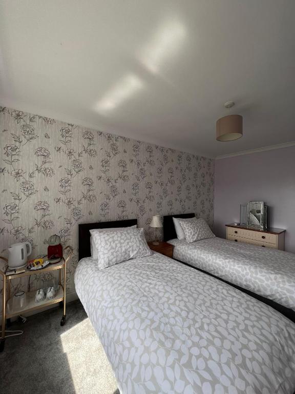 Letto o letti in una camera di Dunrigh Guest House