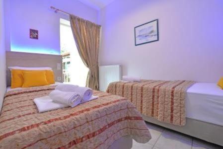 Postel nebo postele na pokoji v ubytování GARBIS Μπακάλης Θεοχάρης