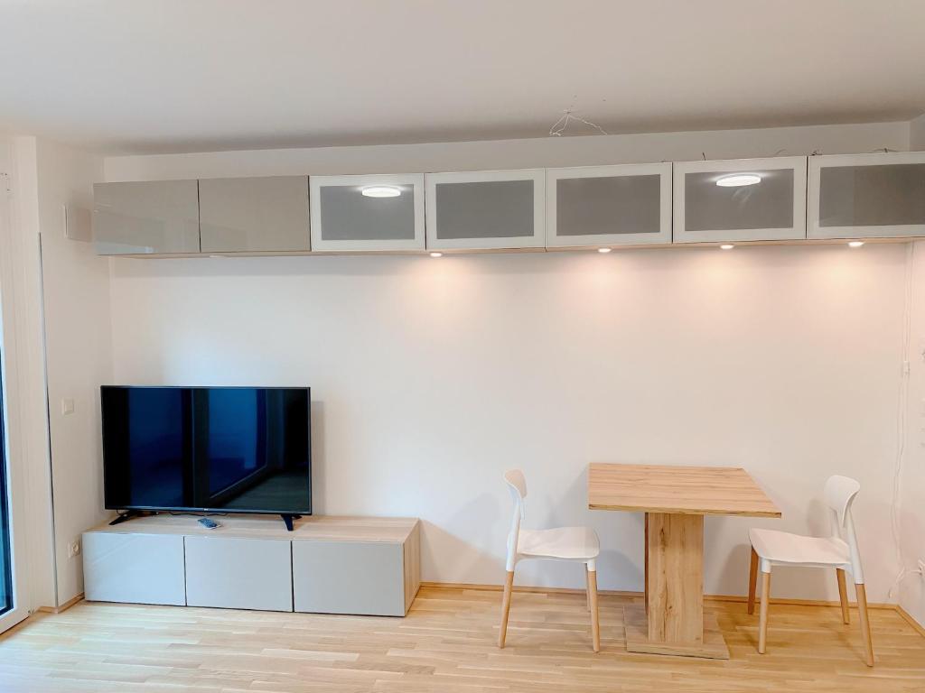 A television and/or entertainment centre at U1 Alte Donau old Danube city apartment 2