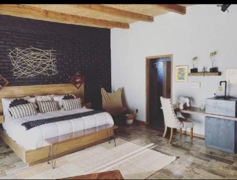 Postel nebo postele na pokoji v ubytování Tierra Madre Hotel Boutique