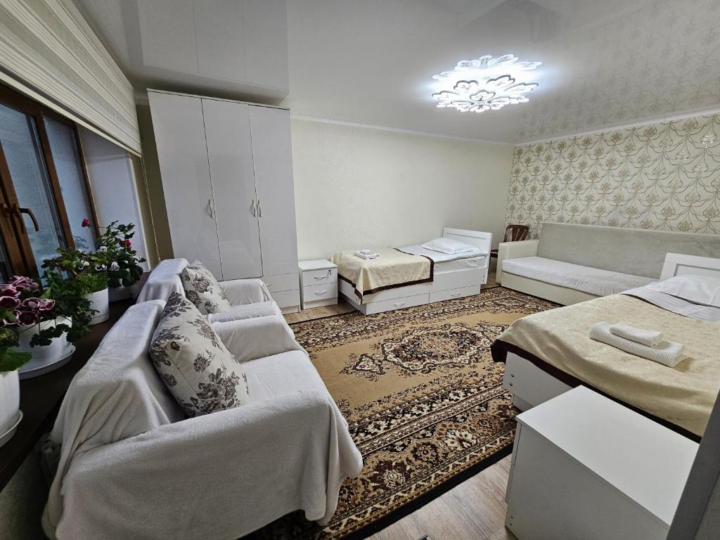 Postel nebo postele na pokoji v ubytování Guest House Tenir Too