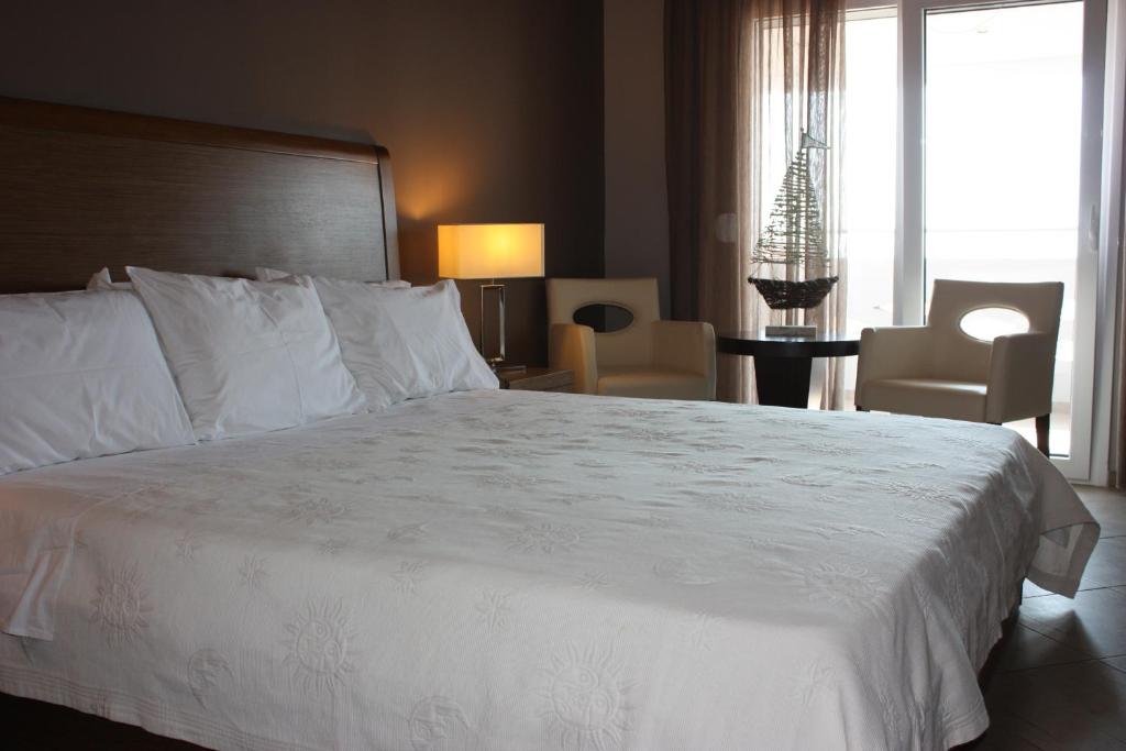 Postel nebo postele na pokoji v ubytování Hotel Cariatis