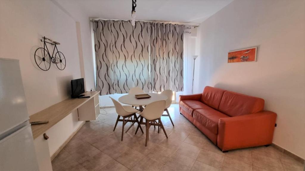 a living room with a couch and a table at BILO EGADI E MONO EGADI in Favignana
