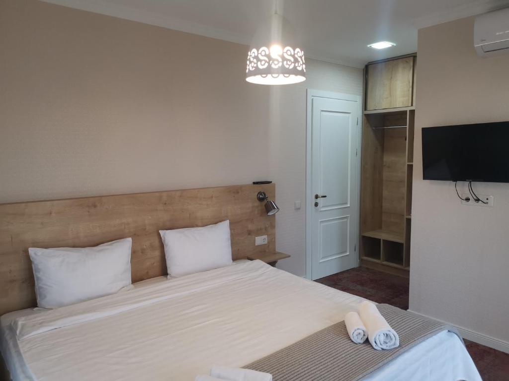 Postel nebo postele na pokoji v ubytování Boutique Hotel BelleVue