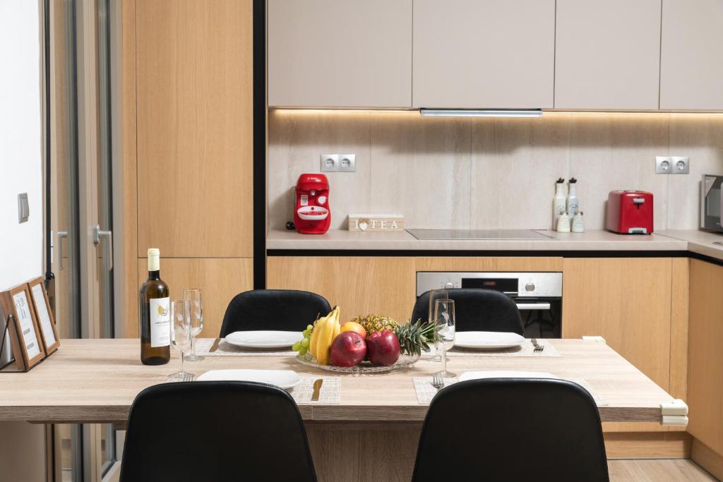 A kitchen or kitchenette at ModernPastel Apartment - Private Parking,Near the Old Port