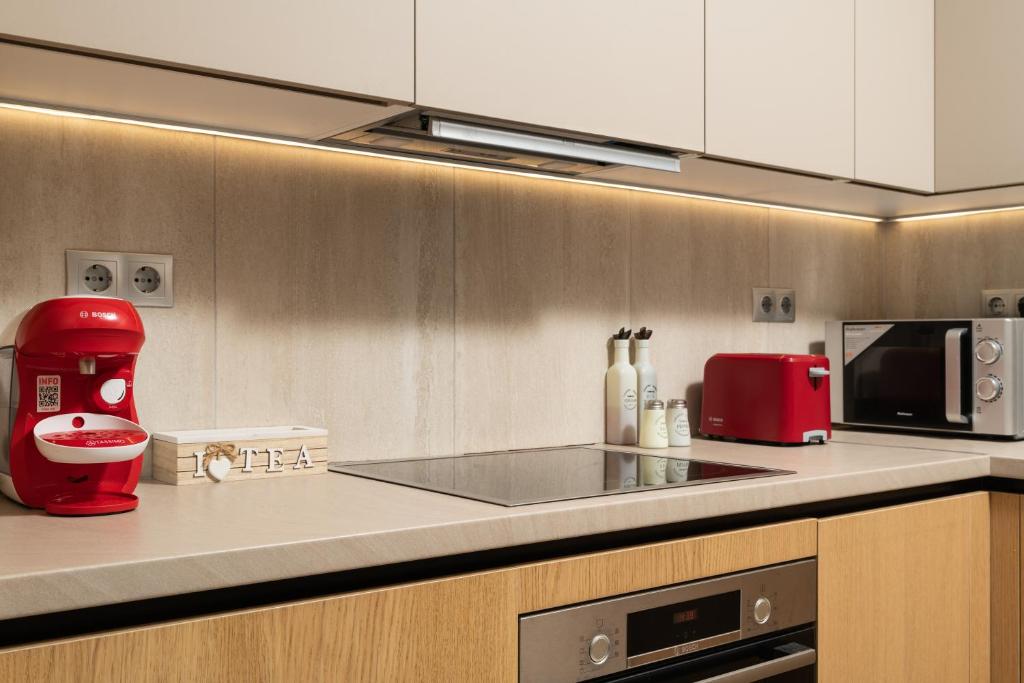 A kitchen or kitchenette at ModernPastel Apartment - Private Parking,Near the Old Port