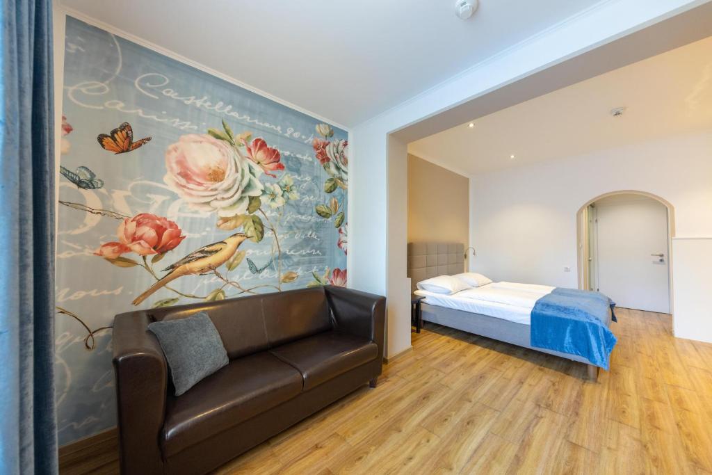 Postel nebo postele na pokoji v ubytování Hotel Unter den Linden