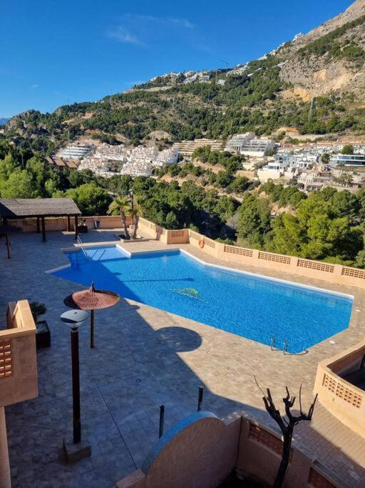 Bazén v ubytovaní Pueblo Mascarat, 50 m al mar, 3 piscinas alebo v jeho blízkosti