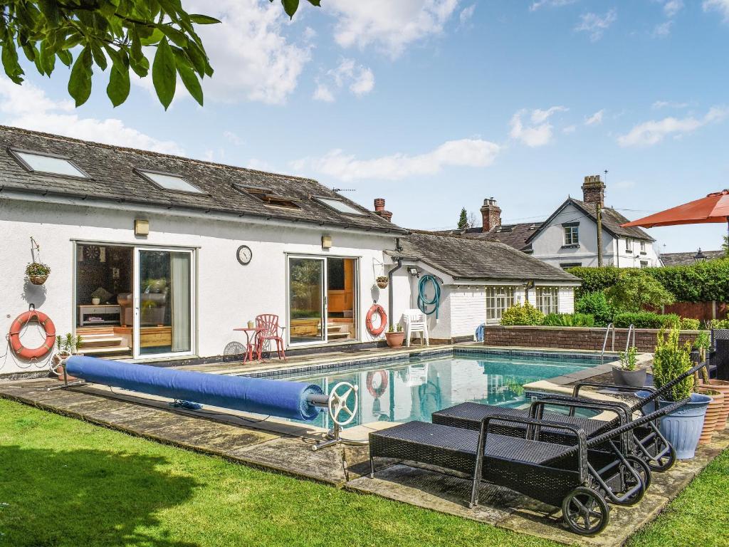 a swimming pool in the backyard of a house at The Pool House in Hale