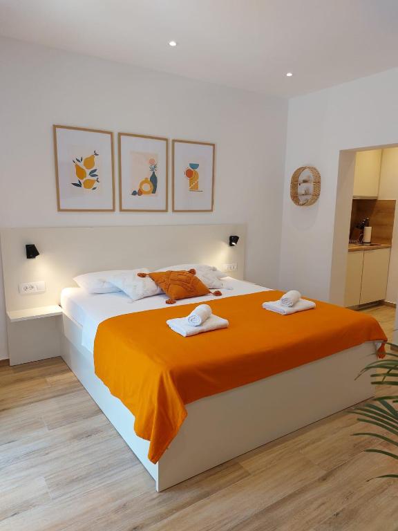 Postel nebo postele na pokoji v ubytování Apartments KIWI