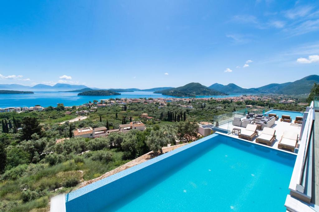 a view of the water from a villa with a swimming pool at 180 Villas in Nydri
