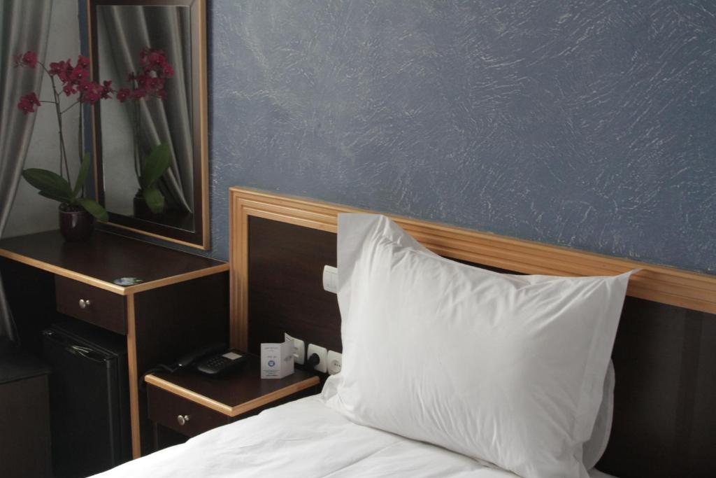 Postel nebo postele na pokoji v ubytování Hôtel Belle Vue et Spa