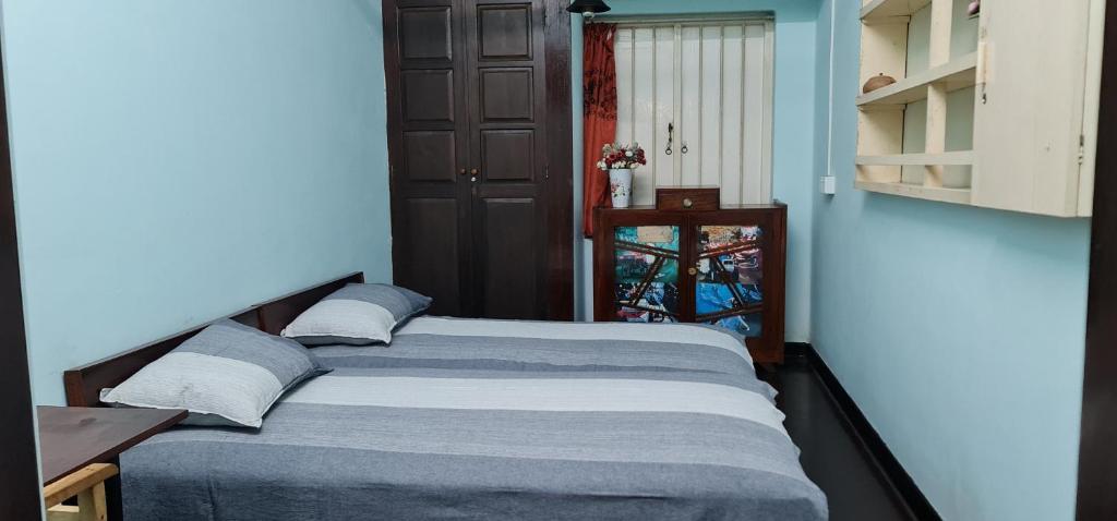 Postel nebo postele na pokoji v ubytování CHARAKAMA Guest Bungalow - GAMPAHA