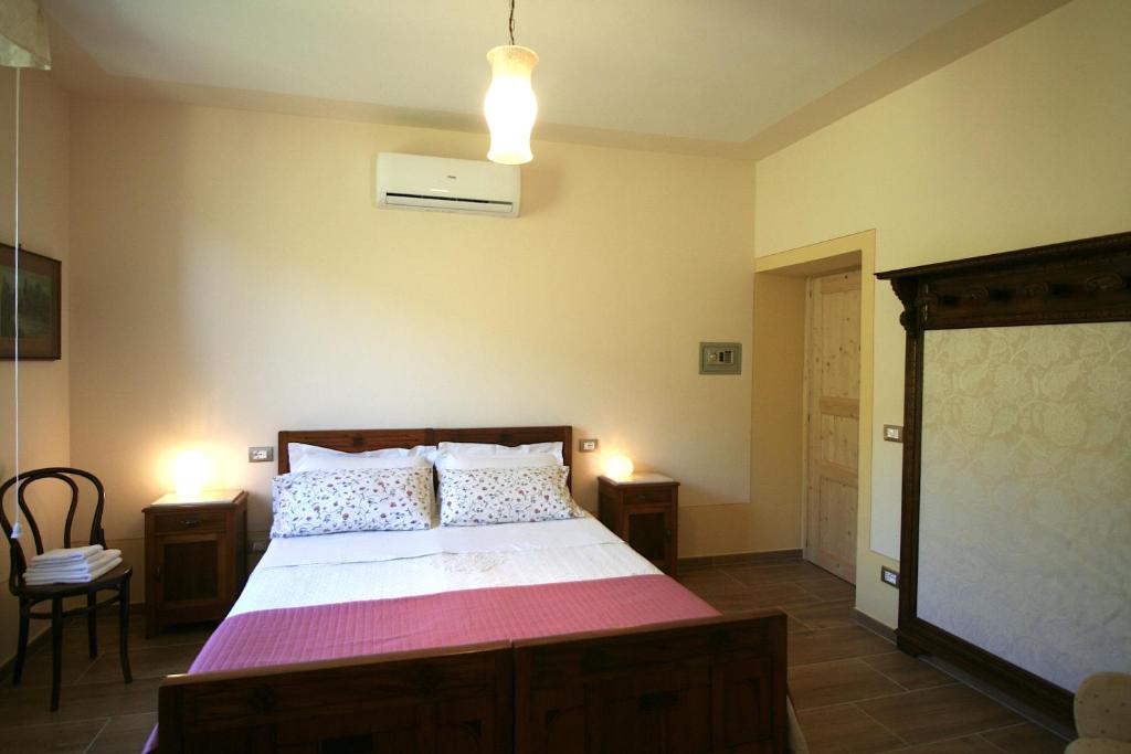 Postel nebo postele na pokoji v ubytování CantoQuinto Bed and Breakfast