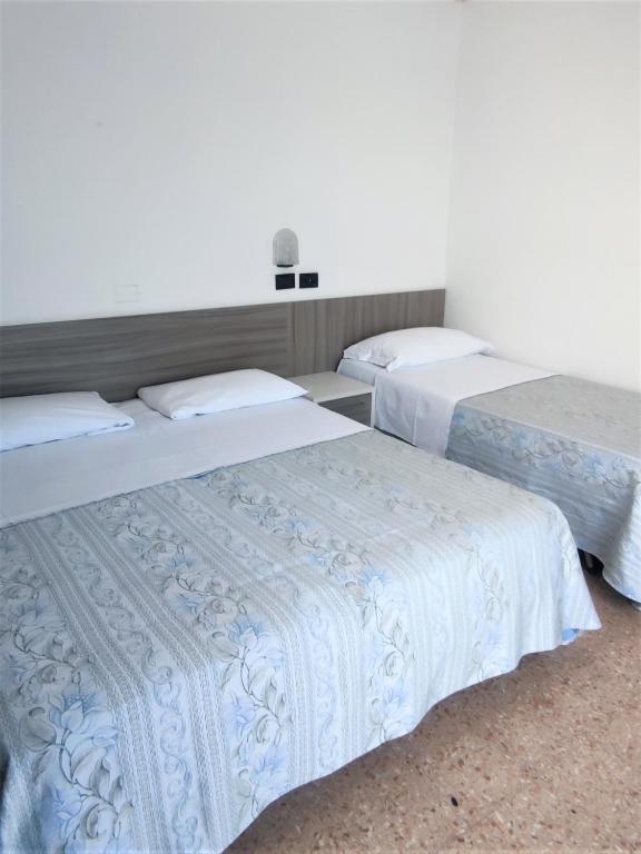 Postel nebo postele na pokoji v ubytování Hotel Ardesia