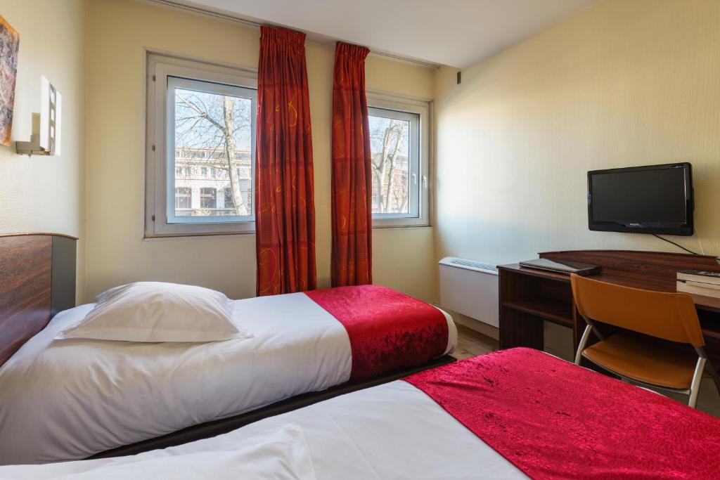 Postel nebo postele na pokoji v ubytování Hôtel Icare