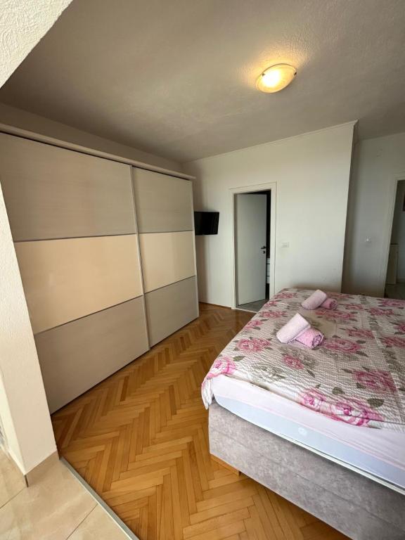 Postel nebo postele na pokoji v ubytování Apartmani Tomaš