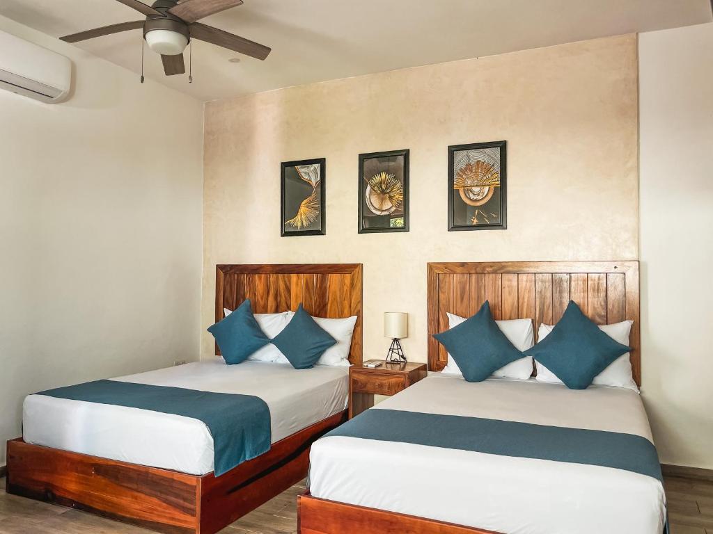 Postel nebo postele na pokoji v ubytování HOTEL KOOKAY VALLADOLID