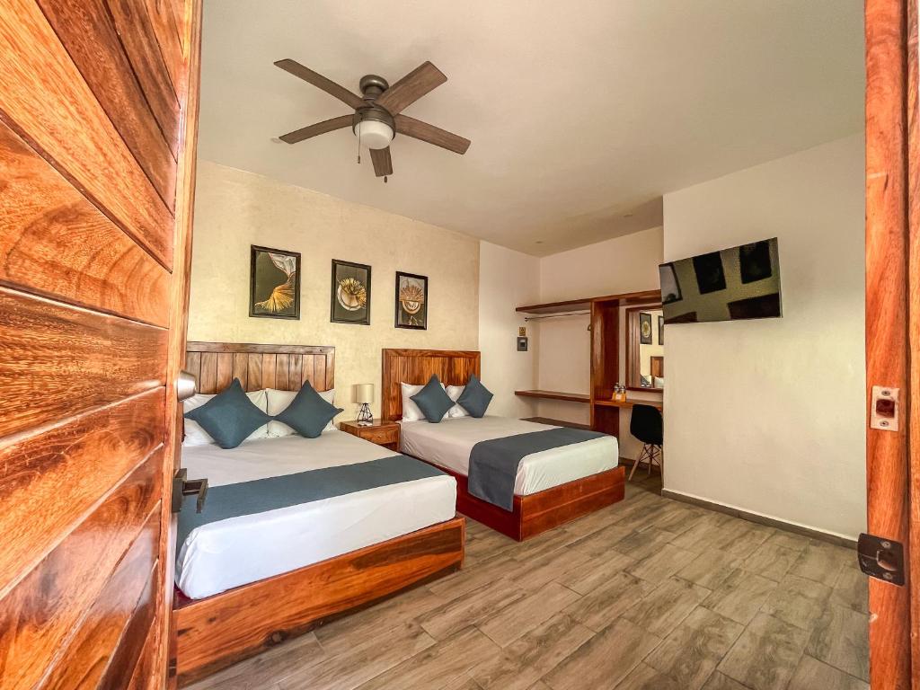 Postel nebo postele na pokoji v ubytování HOTEL KOOKAY VALLADOLID