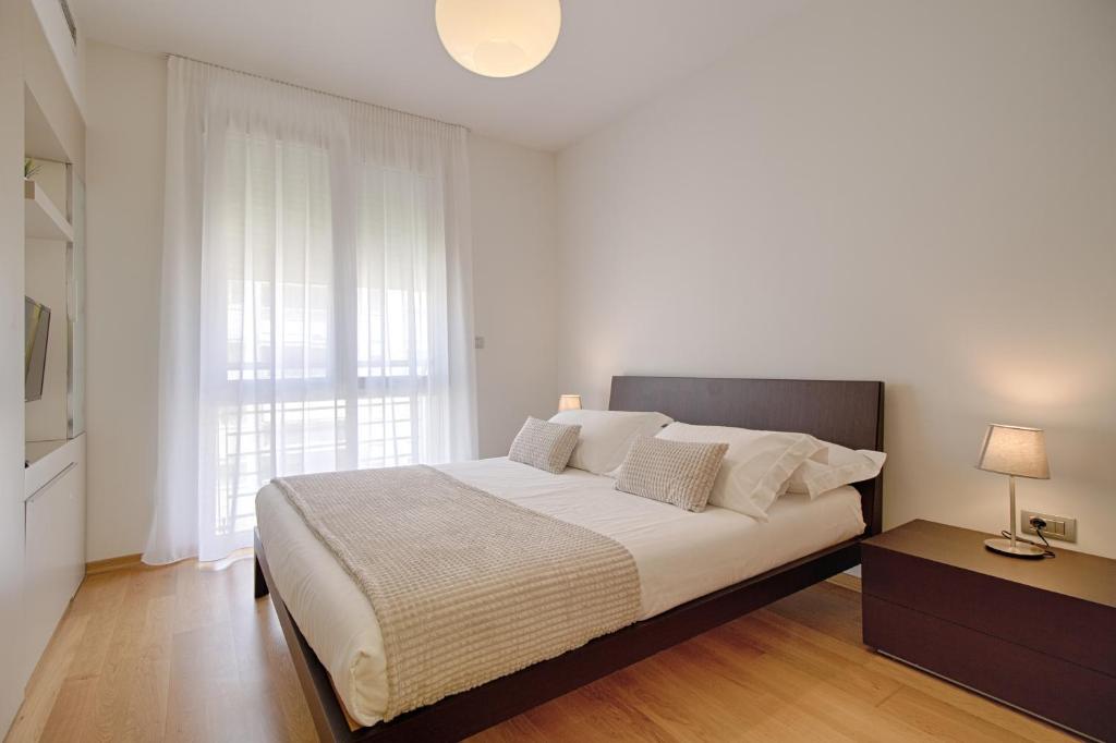 Postel nebo postele na pokoji v ubytování The Rooms Serviced Apartments Tirana