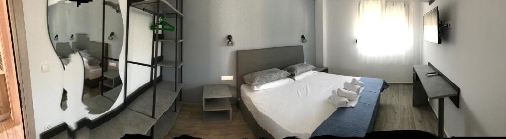 Postel nebo postele na pokoji v ubytování Savvas House