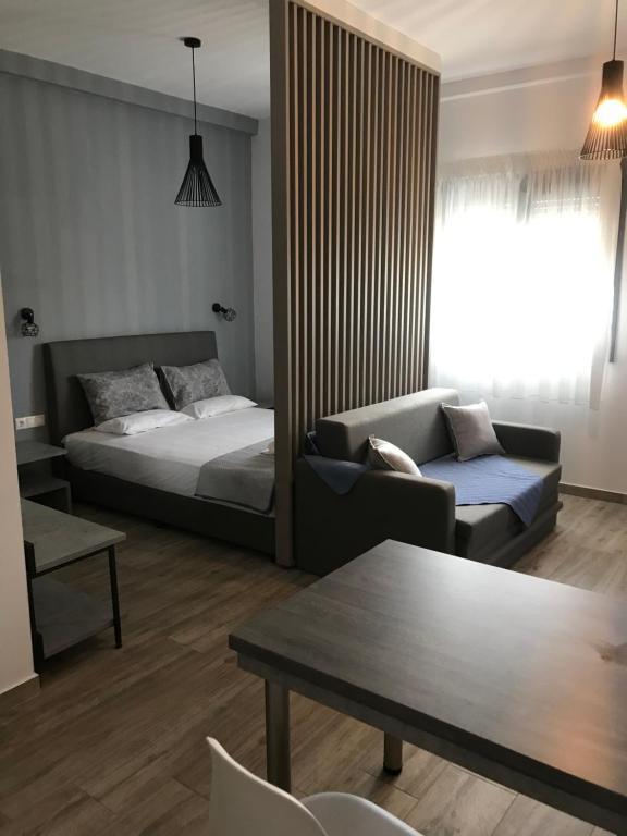 Postel nebo postele na pokoji v ubytování Savvas House