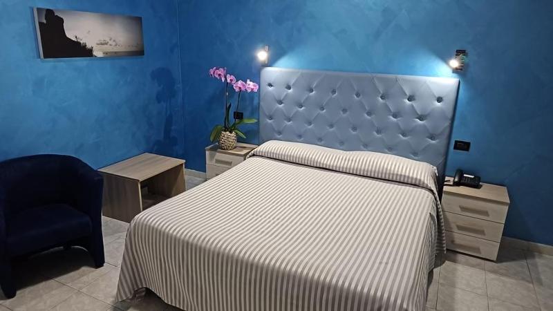 Postel nebo postele na pokoji v ubytování Hotel Il Gioiello