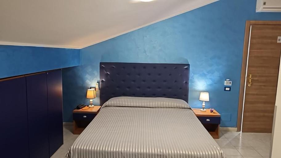Postel nebo postele na pokoji v ubytování Hotel Il Gioiello