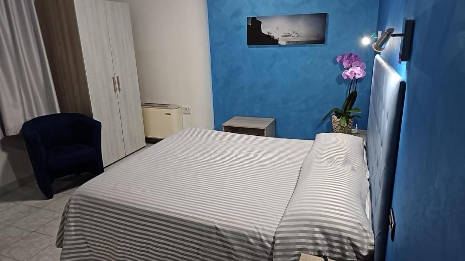 Postel nebo postele na pokoji v ubytování Hotel Il Gioiello