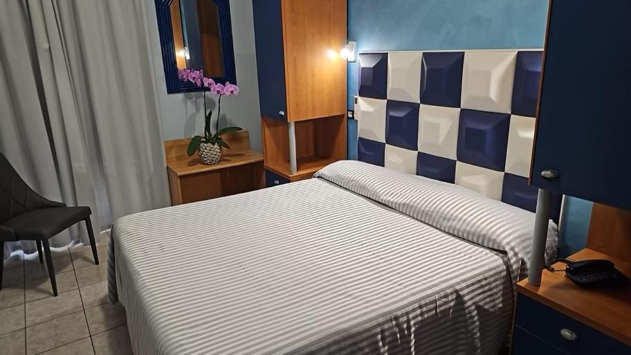 Postel nebo postele na pokoji v ubytování Hotel Il Gioiello