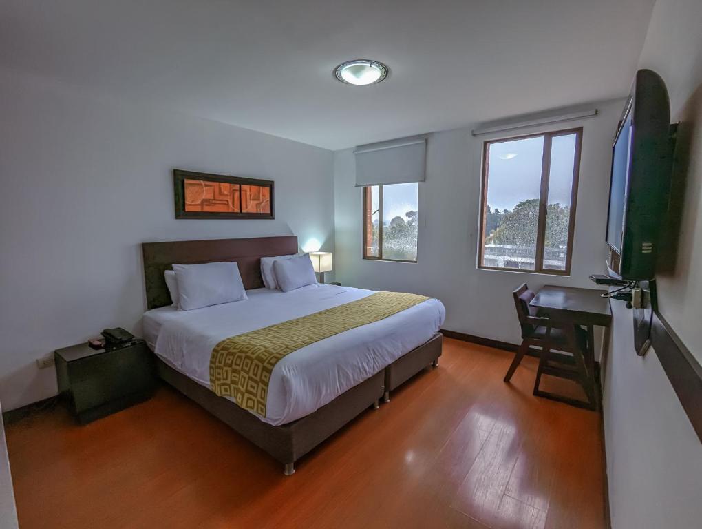Postel nebo postele na pokoji v ubytování Hotel Charlotte Suite 26