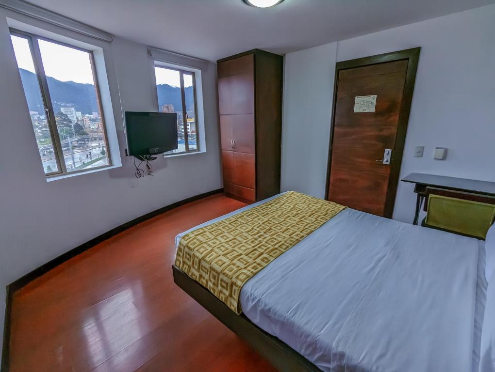 Postel nebo postele na pokoji v ubytování Hotel Charlotte Suite 26