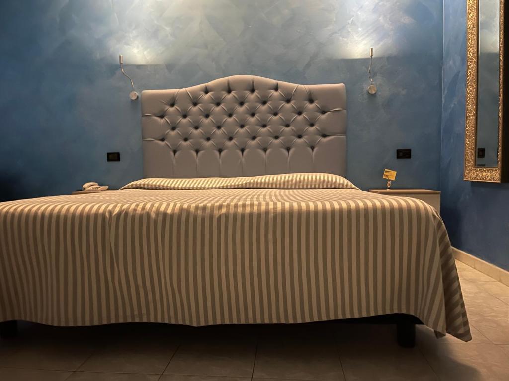Postel nebo postele na pokoji v ubytování Hotel Il Gioiello