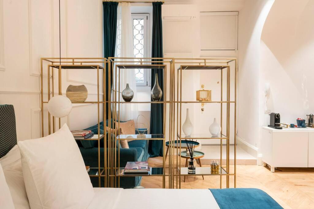 a bedroom with a bed and a gold and white room at LA SCALA SUITE-Luxury Apartment in Milan