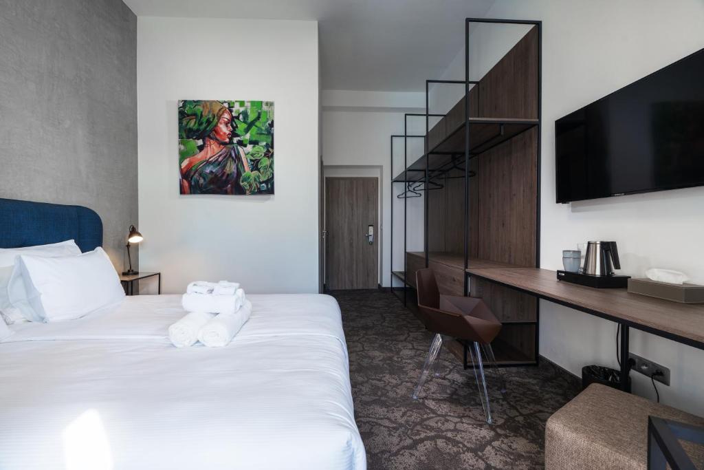 Postel nebo postele na pokoji v ubytování Riverside Hotel Plzeň