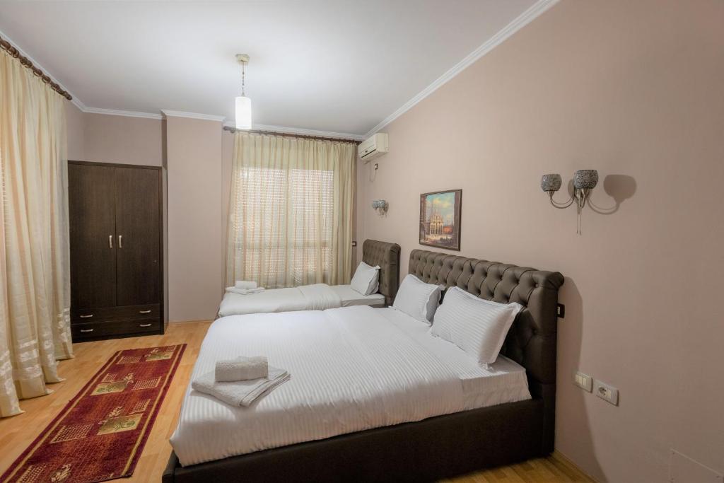 Postel nebo postele na pokoji v ubytování Prince Hotel