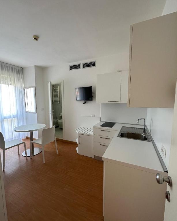 Kuchyň nebo kuchyňský kout v ubytování Hotel Ardea