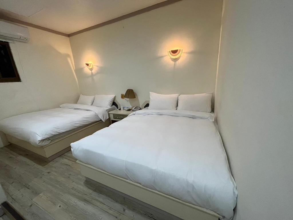 Letto o letti in una camera di 日日 Meworld
