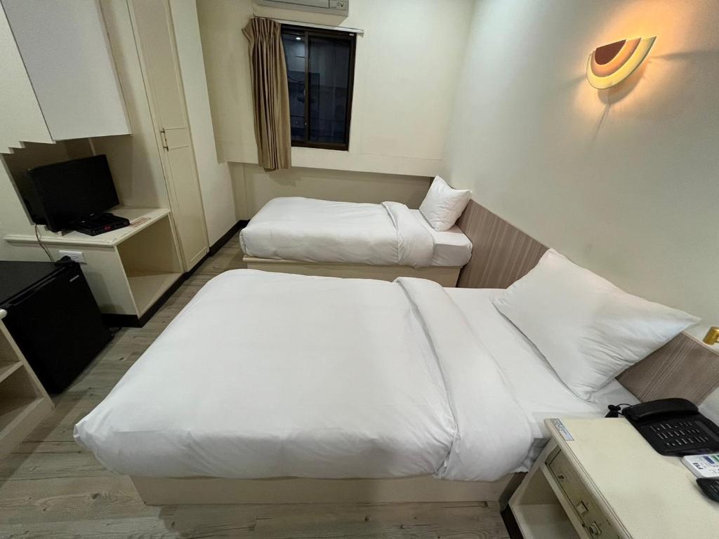 Letto o letti in una camera di 日日 Meworld