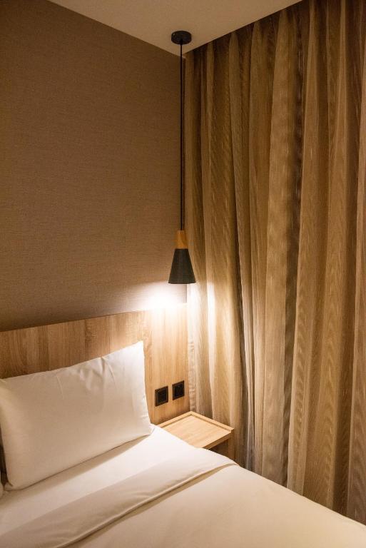 Postel nebo postele na pokoji v ubytování N Hotel