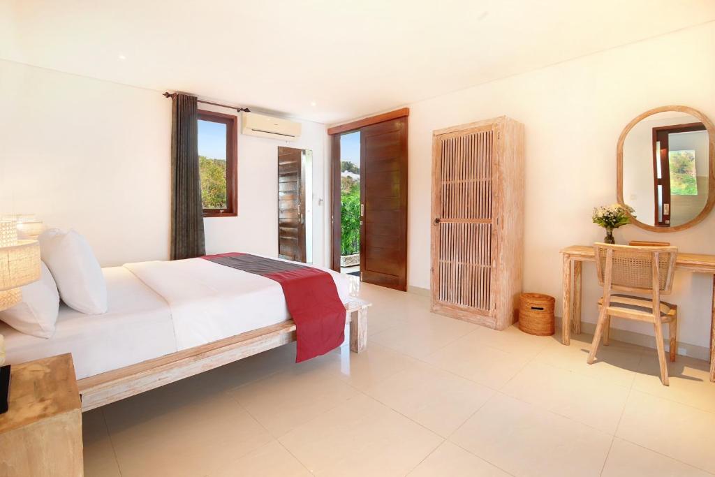 Een bed of bedden in een kamer bij Kandahill Bali