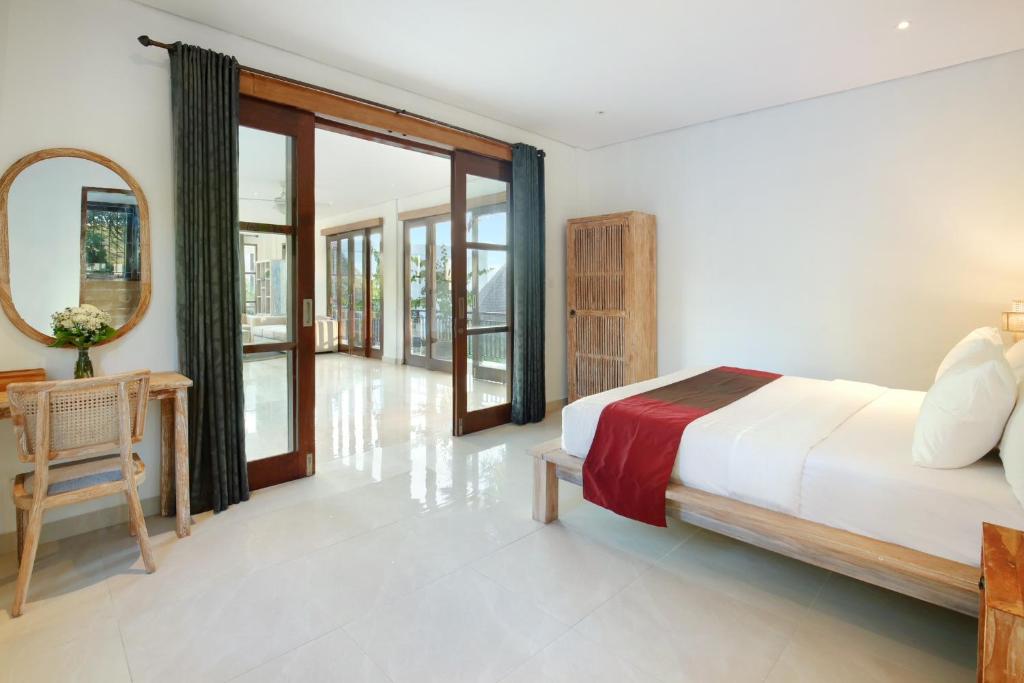 Een bed of bedden in een kamer bij Kandahill Bali