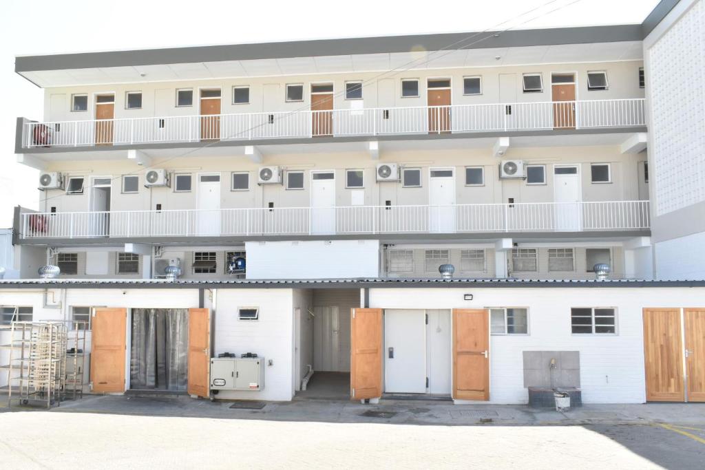 an external view of an apartment building with its doors open at Urban Oasis Apartments at Hidas in Windhoek