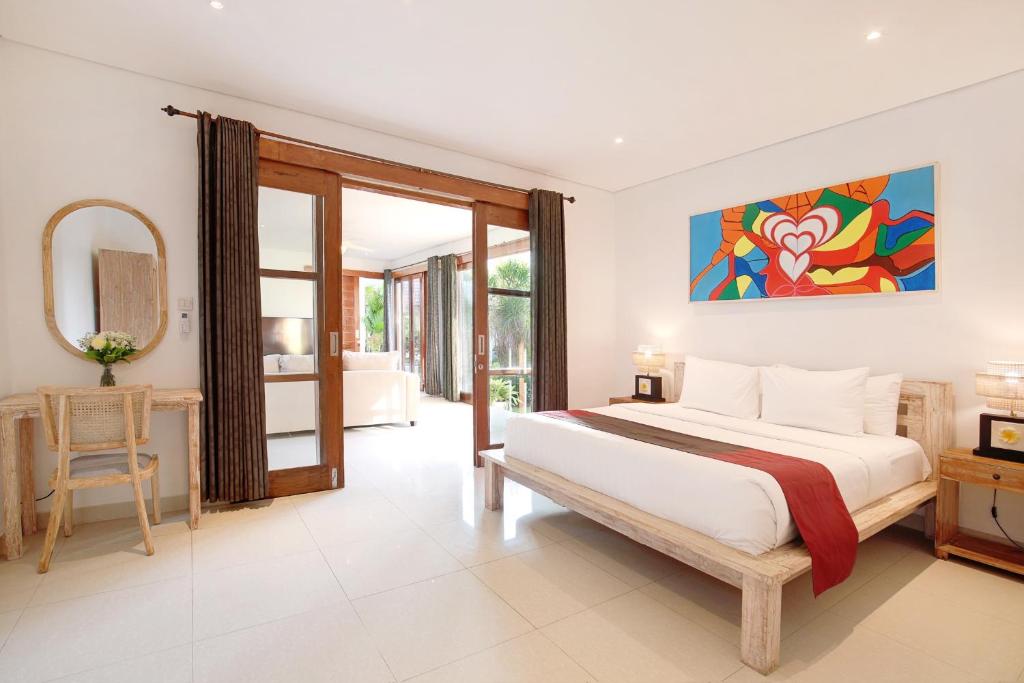 Een bed of bedden in een kamer bij Kandahill Bali