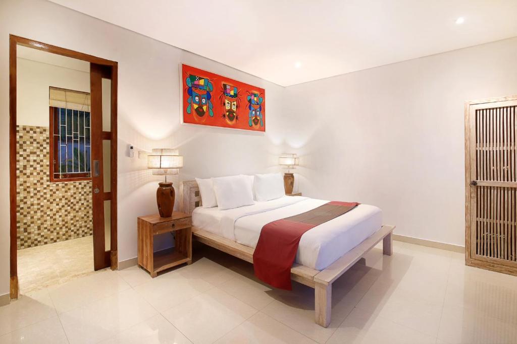 Een bed of bedden in een kamer bij Kandahill Bali