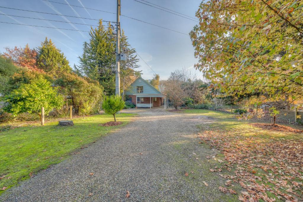an empty road in front of a house at 406 Back Porepunkah Road, Bright in Bright